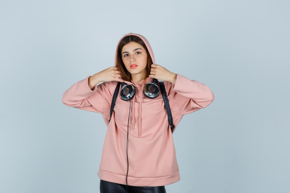 The girl with the headphones and the fleece hoodie