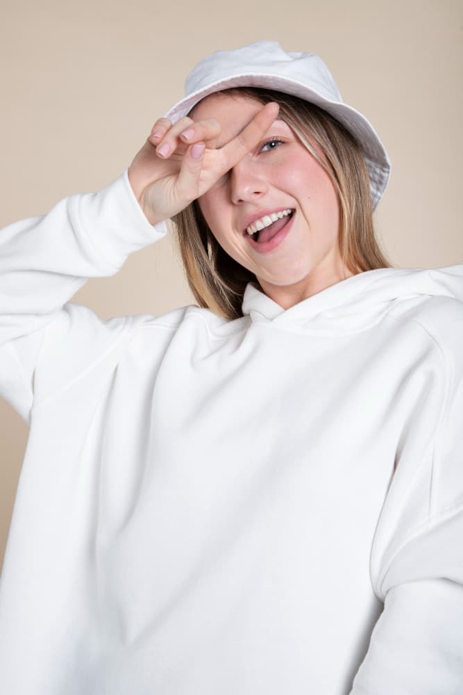 Short-haired girl with a white hat wearing a white blank hoodie
