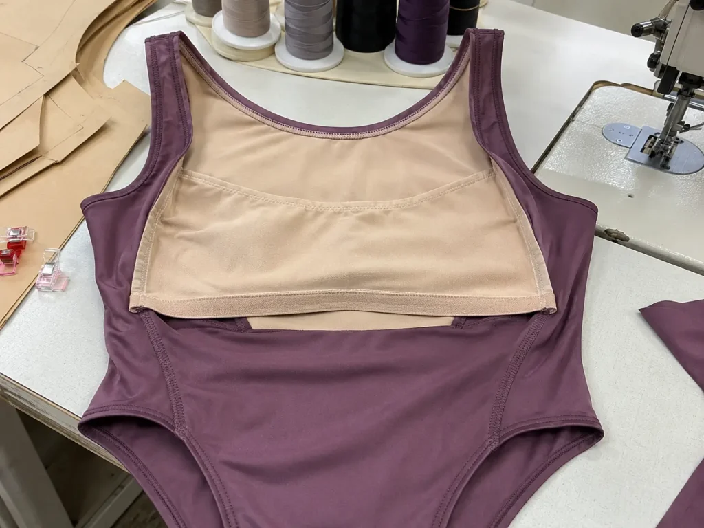 built-in shelf bra lining stitched into the front panel of a leotard